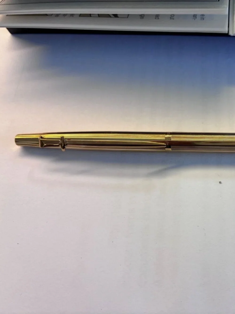 CARAN D'ACHE GOLD BALLPOINT PEN FROM MID 1980s WITH PAPERS AND BOX